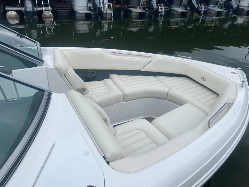 Slide: The Image of 2016 Cobalt R5 WSS boat with white leather seating in marina. - 12