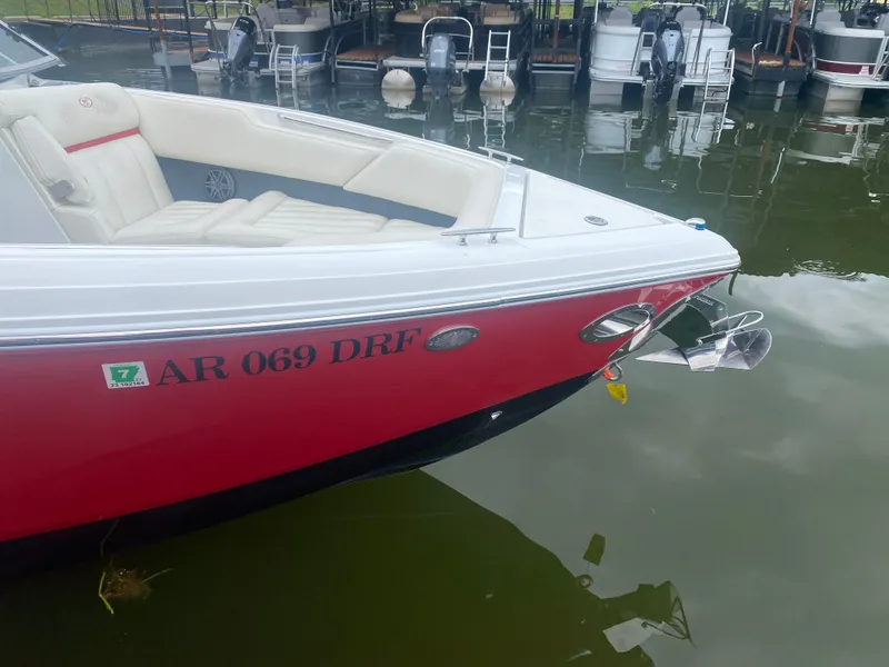 Slide: The Image of 2016 Cobalt R5 WSS boat docked, red hull, white interior, registration AR 069 DRF. - 13