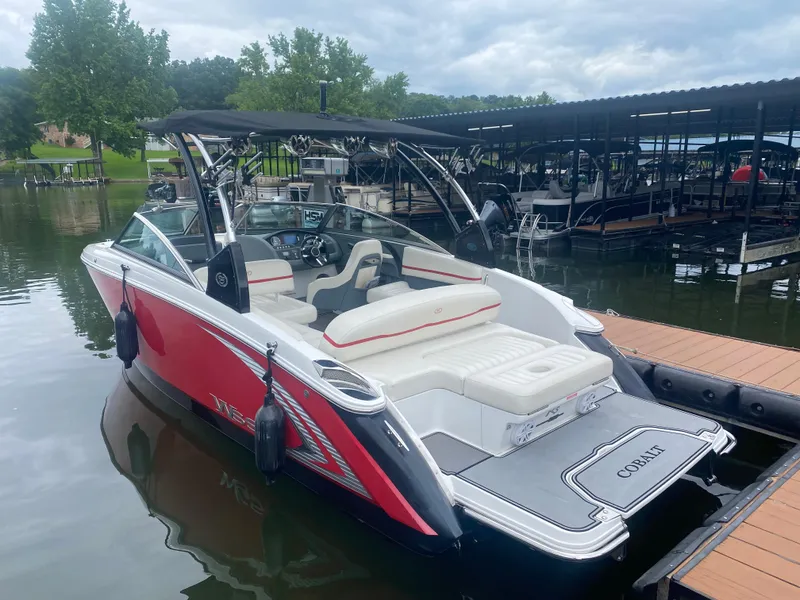 Slide: The Image of 2016 Cobalt R5 WSS boat docked at a marina. - 3