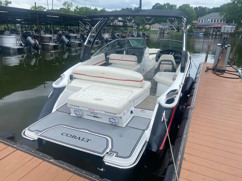 Slide: The Image of 2016 Cobalt R5 WSS boat docked at a marina. - 5