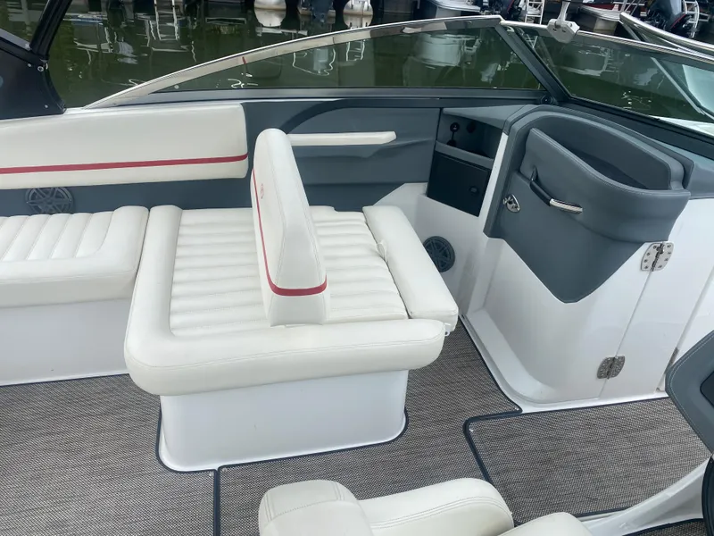 Slide: The Image of 2016 Cobalt R5 WSS boat interior with white and gray seating. - 8