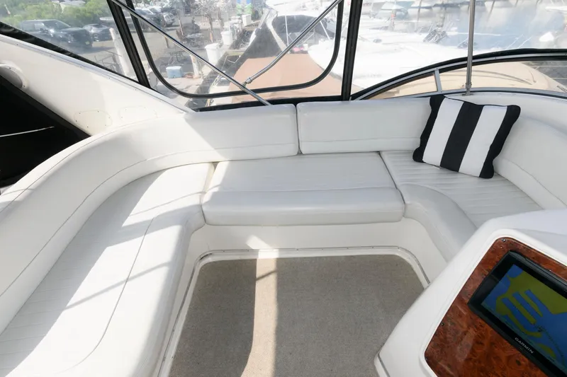 Slide: The Image of 2004 Meridian 381 Sedan interior with white seating and striped pillow. - 10