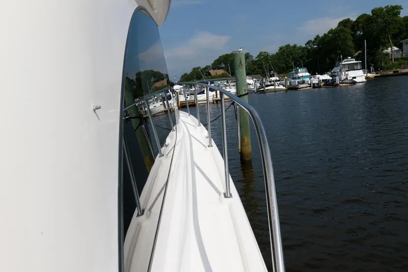 Slide: The Image of Side view of a 2004 Meridian 381 Sedan yacht docked at a marina. - 13