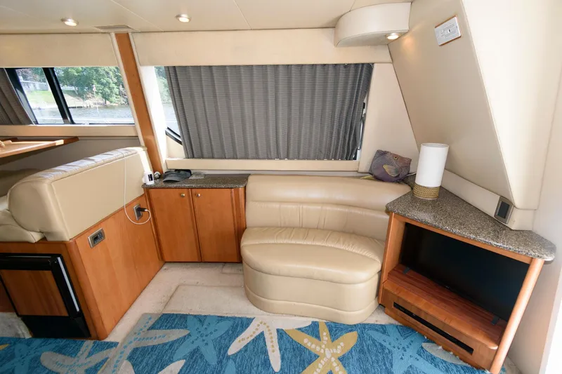 Slide: The Image of 2004 Meridian 381 Sedan interior with beige leather seating and wooden cabinetry. - 16