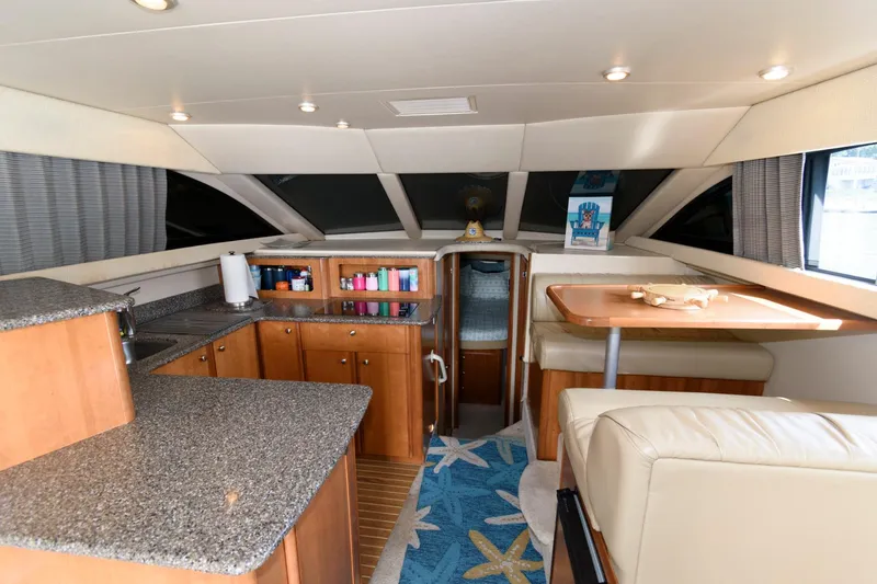 Slide: The Image of 2004 Meridian 381 Sedan interior with kitchen, dining area, and cabin. - 17