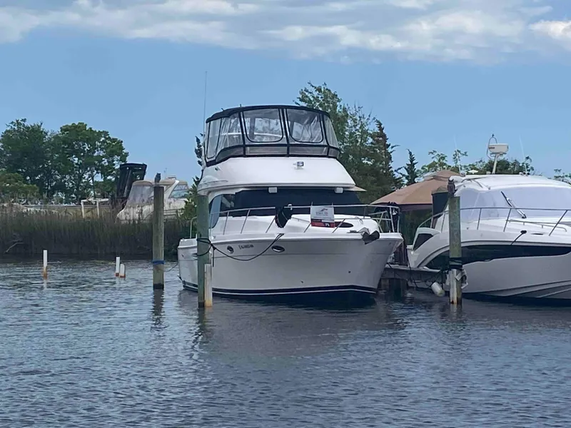 Slide: The Image of 2004 Meridian 381 Sedan yacht docked at a marina. - 2