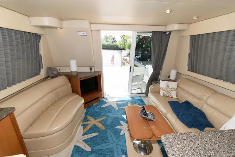Slide: The Image of Luxurious interior of a 2004 Meridian 381 Sedan yacht with leather seating and starfish-themed decor. - 20