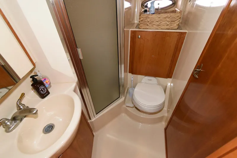 Slide: The Image of 2004 Meridian 381 Sedan bathroom with sink, toilet, and shower. - 23