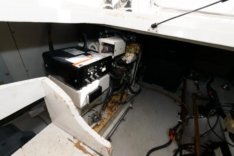 Slide: The Image of Engine compartment of a 2004 Meridian 381 Sedan boat showing mechanical components. - 24
