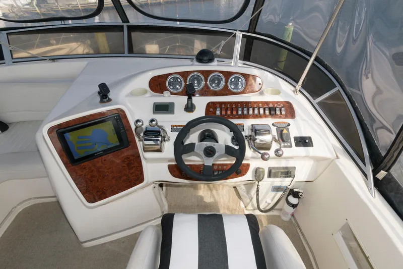Slide: The Image of 2004 Meridian 381 Sedan helm with navigation system and control panel. - 7