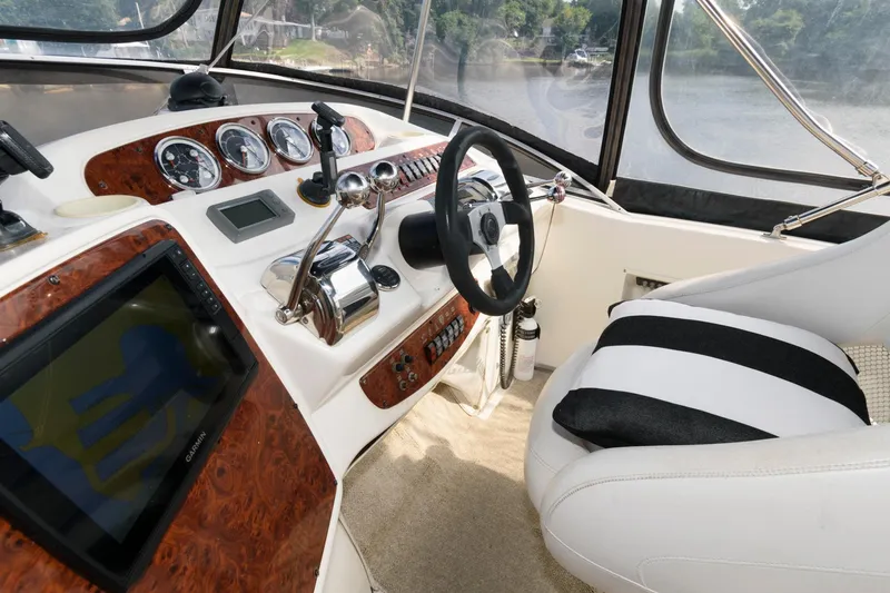 Slide: The Image of 2004 Meridian 381 Sedan helm with modern navigation instruments and comfortable seating. - 8