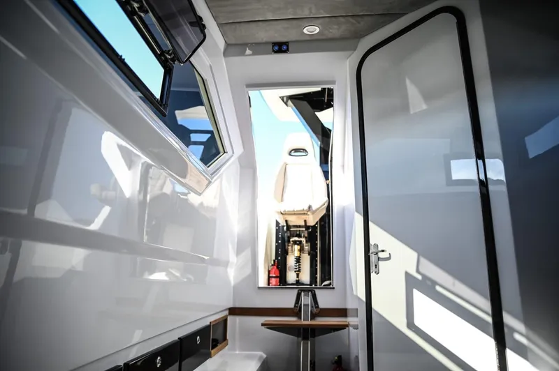 Slide: The Image of Interior of 2025 DNA 46 boat with modern design and open windows. - 22