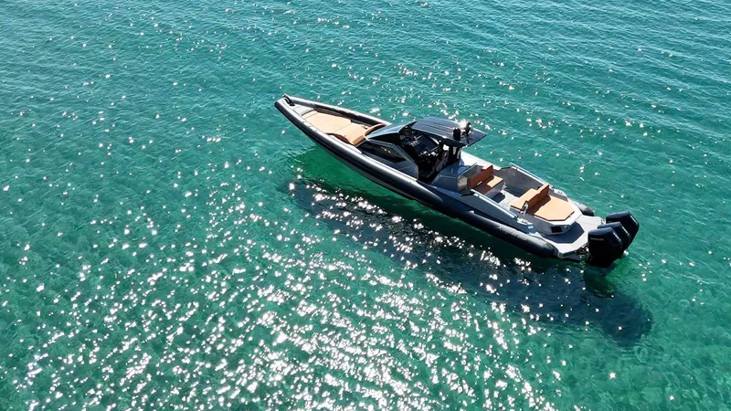 Slide: The Image of Modern DNA 46 boat cruising on clear turquoise water, 2025 model. - 3