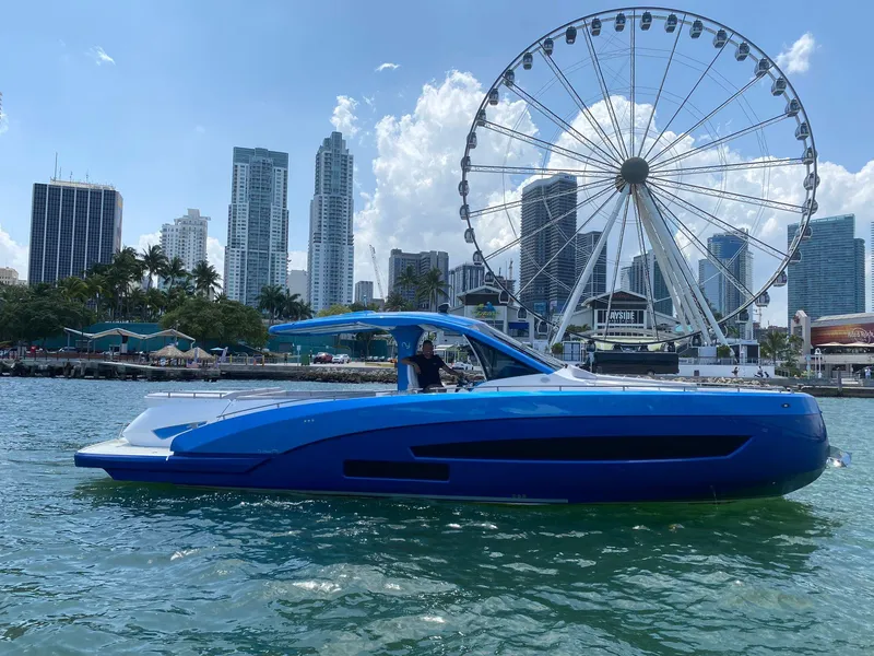 The Image of Nassima Yacht N40 2025 cruising near city skyline and Ferris wheel. - 0