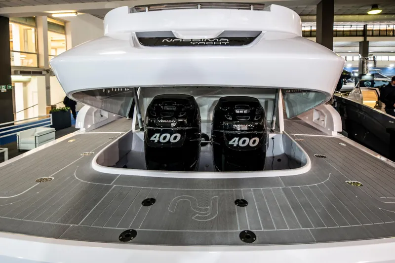 Slide: The Image of Nassima Yacht N40 2025 model with dual 400 horsepower engines in a showroom. - 19
