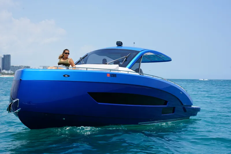 Slide: The Image of 2025 Nassima Yacht N40 cruising on the ocean with a woman on deck. - 2