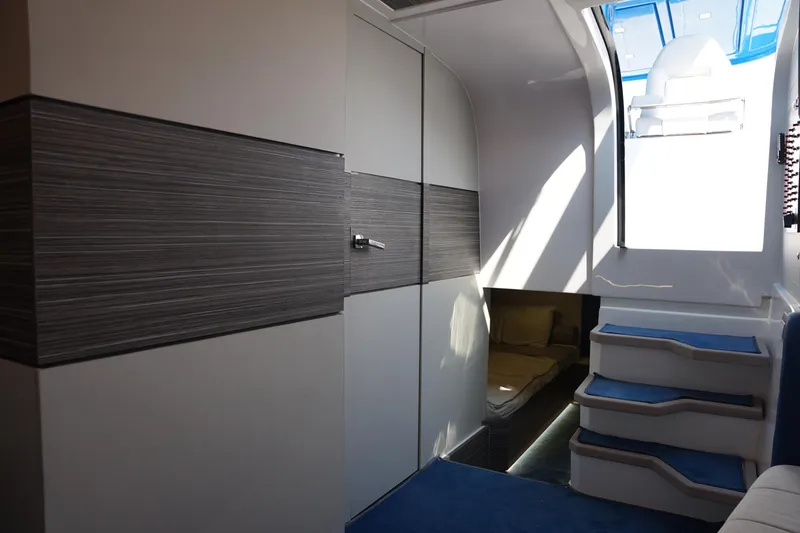 Slide: The Image of Interior of 2025 Nassima Yacht N40, featuring modern design and blue-accented stairs. - 24