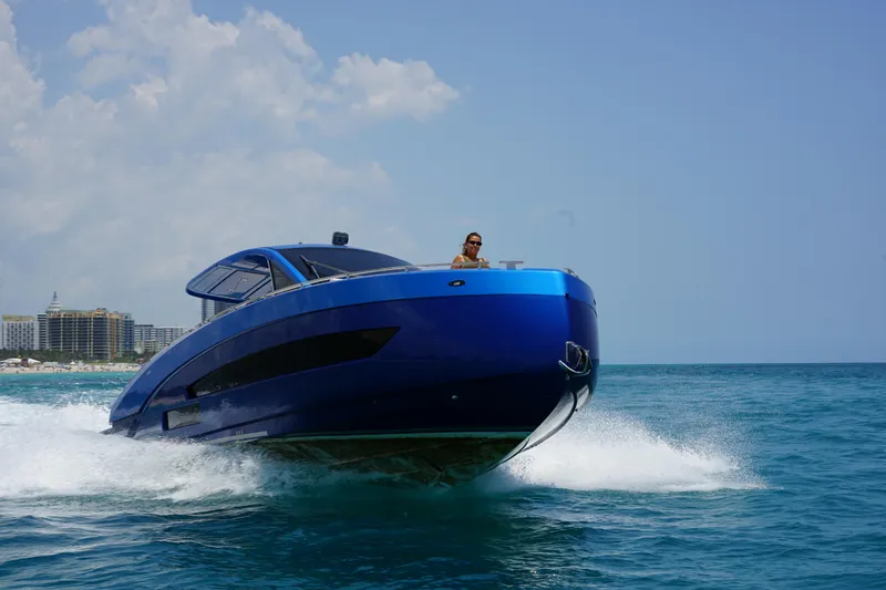 Slide: The Image of Nassima Yacht N40 2025 cruising on the ocean, blue luxury boat in motion. - 5