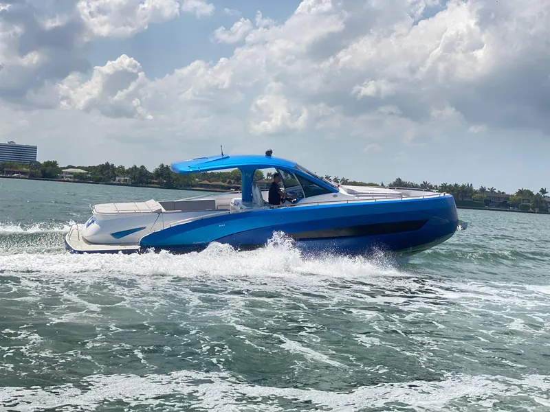 Slide: The Image of 2025 Nassima Yacht N40 cruising on the water under a partly cloudy sky. - 8