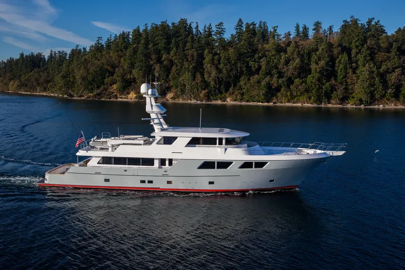 The Image of Nordlund Expedition Yachtfisher 2019 cruising near forested shoreline. - 0