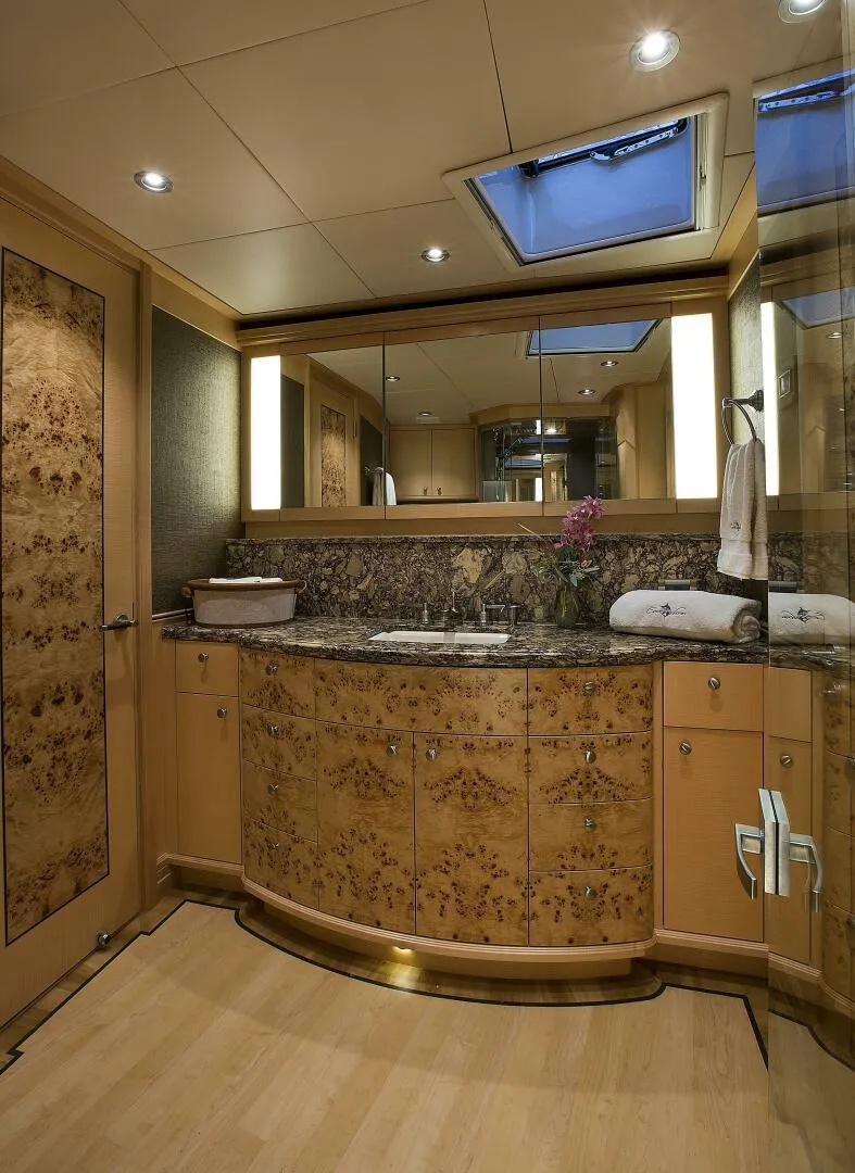 Slide: The Image of Luxurious bathroom in 2019 Nordlund Expedition Yachtfisher with elegant wood cabinetry and granite countertop. - 12