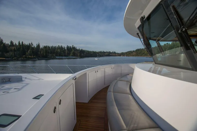 Slide: The Image of 2019 Nordlund Expedition Yachtfisher deck with scenic water and forest view. - 15