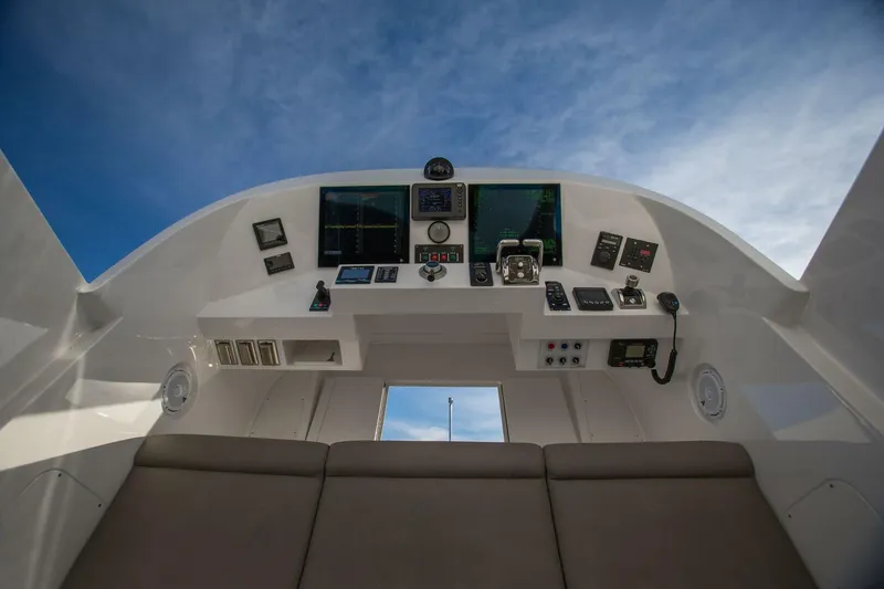 Slide: The Image of 2019 Nordlund Expedition Yachtfisher cockpit with advanced navigation systems under a clear sky. - 21
