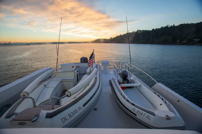 Slide: The Image of 2019 Nordlund Expedition Yachtfisher at sunset with two dinghies on deck. - 26