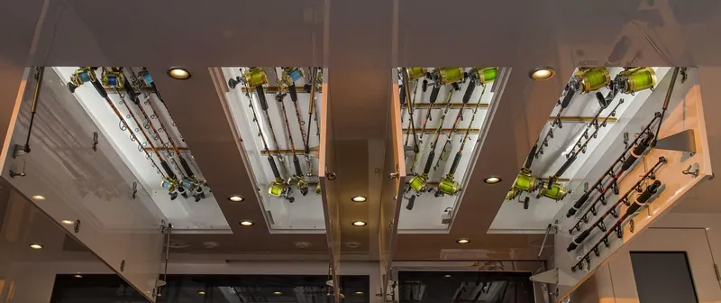 Slide: The Image of Fishing rod storage on 2019 Nordlund Expedition Yachtfisher, ceiling-mounted racks with lighting. - 29