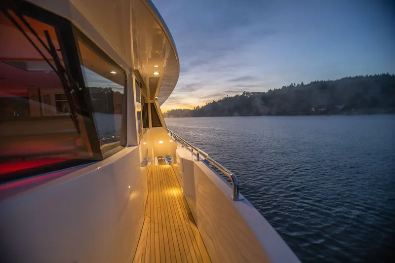 Slide: The Image of Side deck view of 2019 Nordlund Expedition Yachtfisher at sunset on calm waters. - 37