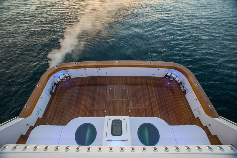 Slide: The Image of 2019 Nordlund Expedition Yachtfisher deck overlooking calm ocean waters. - 44