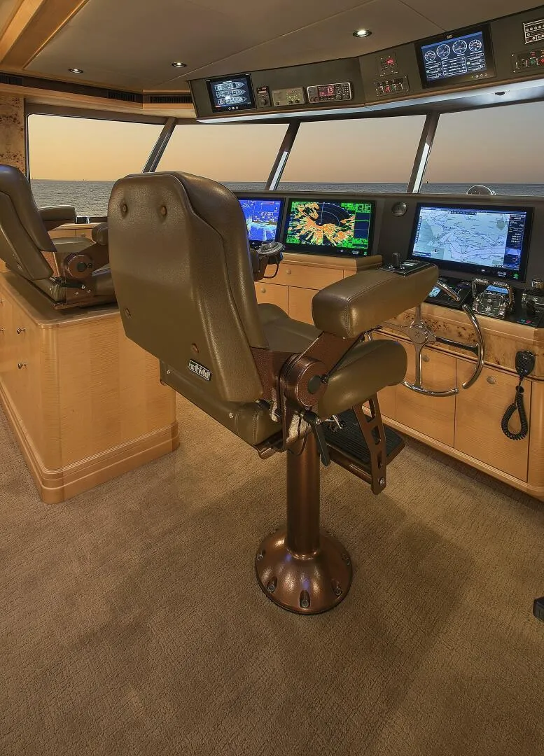 Slide: The Image of 2019 Nordlund Expedition Yachtfisher helm with advanced navigation systems and captain's chair. - 7