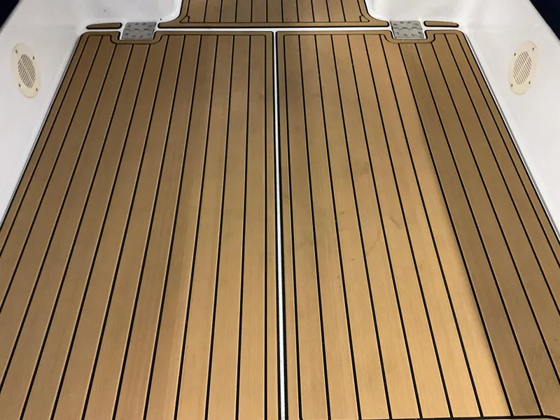 Slide: The Image of Teak deck of 2000 Mainship Pilot boat, featuring sleek, parallel lines and durable construction. - 12