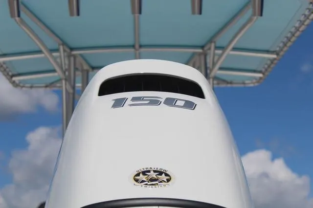 Slide: The Image of Outboard motor with "150" label on a 2021 Blue Wave 2000 Pure Bay boat. - 10