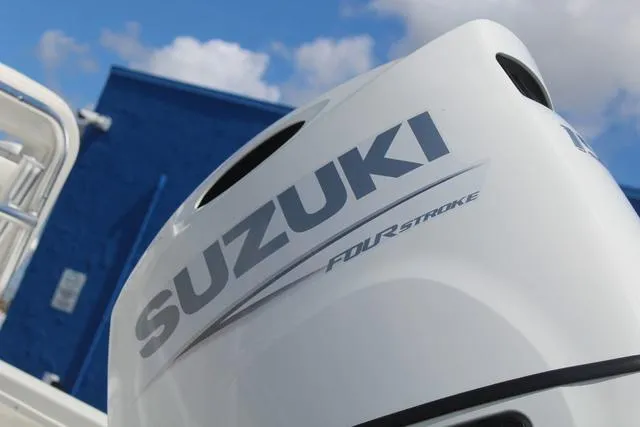 Slide: The Image of Suzuki four-stroke engine on 2021 Blue Wave 2000 Pure Bay boat, blue sky background. - 11