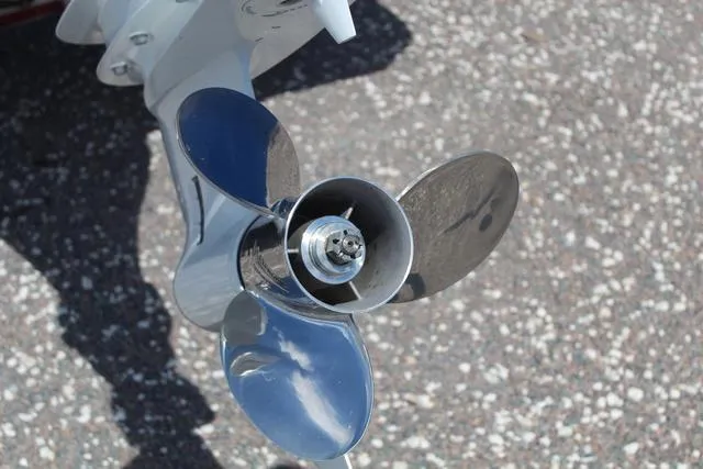 Slide: The Image of Propeller of 2021 Blue Wave 2000 Pure Bay boat on textured surface. - 13