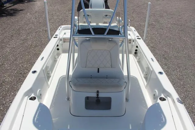 Slide: The Image of 2021 Blue Wave 2000 Pure Bay boat interior with seating and storage compartments. - 15