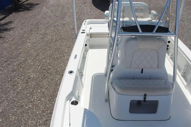 Slide: The Image of 2021 Blue Wave 2000 Pure Bay boat interior with white seating and console. - 16