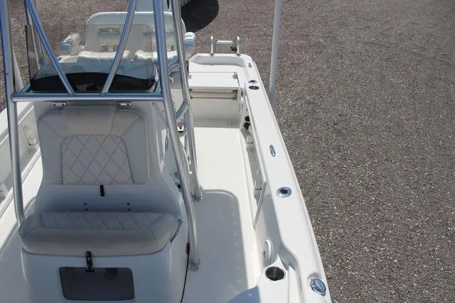 Slide: The Image of 2021 Blue Wave 2000 Pure Bay boat interior with white seating and stainless steel fixtures. - 17