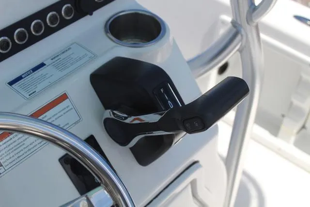 Slide: The Image of Control panel of a 2021 Blue Wave 2000 Pure Bay boat with throttle lever. - 20