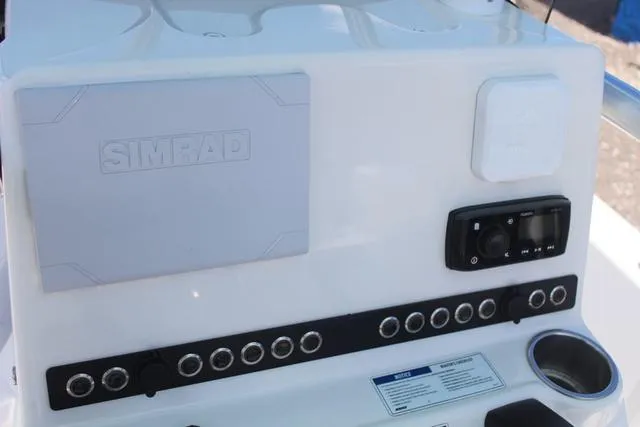 Slide: The Image of Control panel of 2021 Blue Wave 2000 Pure Bay boat with Simrad electronics. - 21
