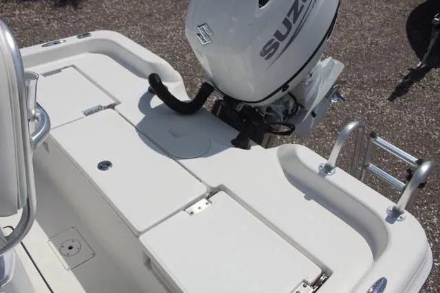 Slide: The Image of 2021 Blue Wave 2000 Pure Bay boat with Suzuki outboard motor, featuring a spacious deck. - 22