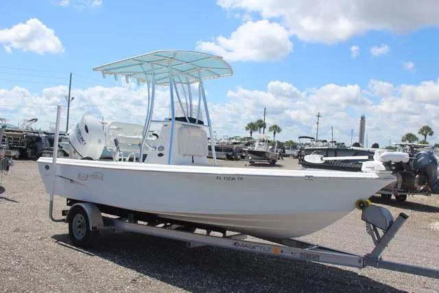 Slide: The Image of 2021 Blue Wave 2000 Pure Bay boat on trailer under blue sky. - 3