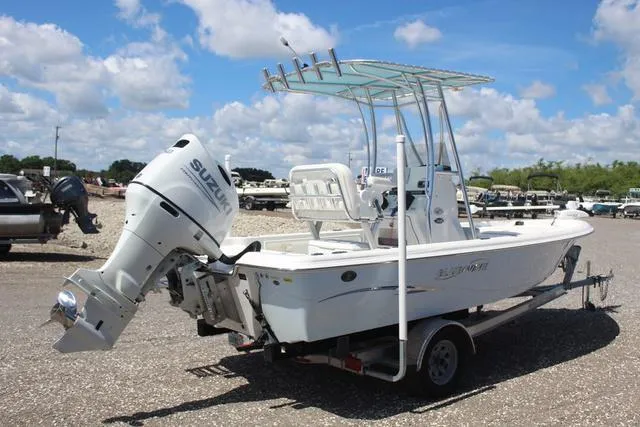 Slide: The Image of 2021 Blue Wave 2000 Pure Bay boat with Suzuki outboard motor on trailer. - 4