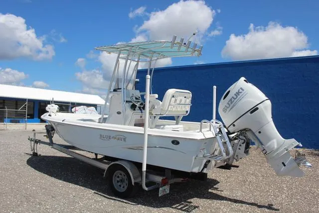 Slide: The Image of 2021 Blue Wave 2000 Pure Bay boat with Suzuki outboard motor on trailer. - 6