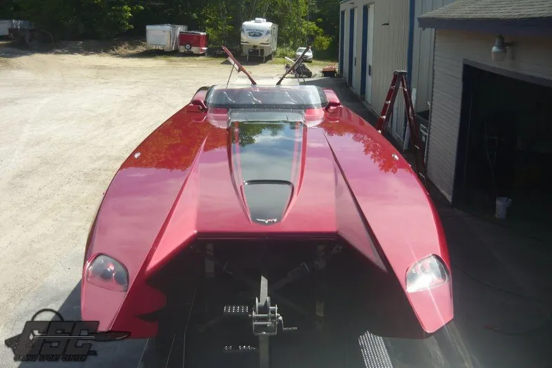 Slide: The Image of Red 2010 MTI 44 Corvette powerboat on trailer, parked in marina lot. - 19
