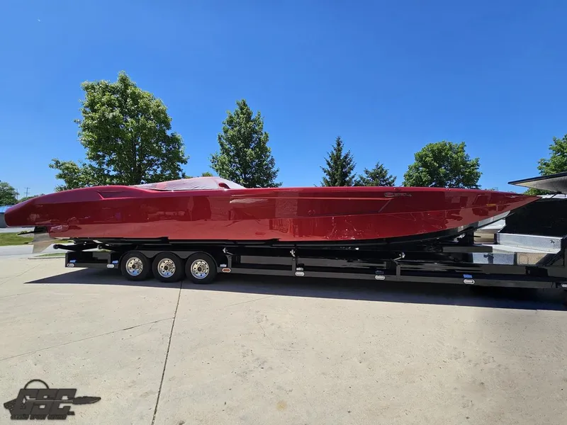Slide: The Image of Red 2010 MTI 44 Corvette powerboat on trailer at Grand Sport Center. - 2