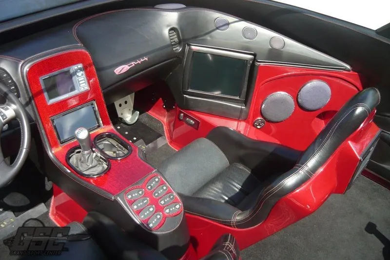 Slide: The Image of Red 2010 MTI 44 Corvette powerboat on trailer under clear blue sky. - 26