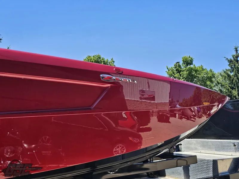 Slide: The Image of Red 2010 MTI 44 Corvette boat at Grand Sport Center, viewed from above. - 3