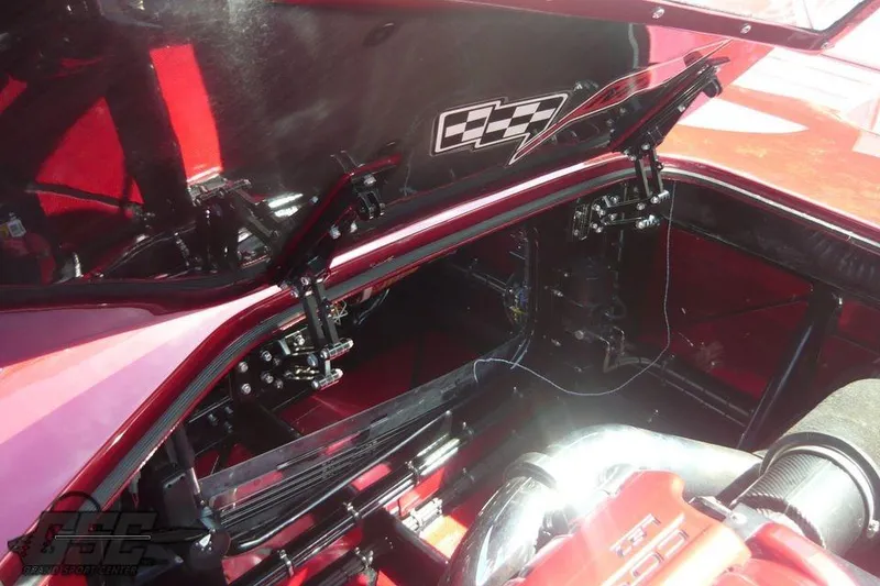 Slide: The Image of Rear view of a 2010 MTI 44 Corvette boat with dual exhausts and red finish. - 33